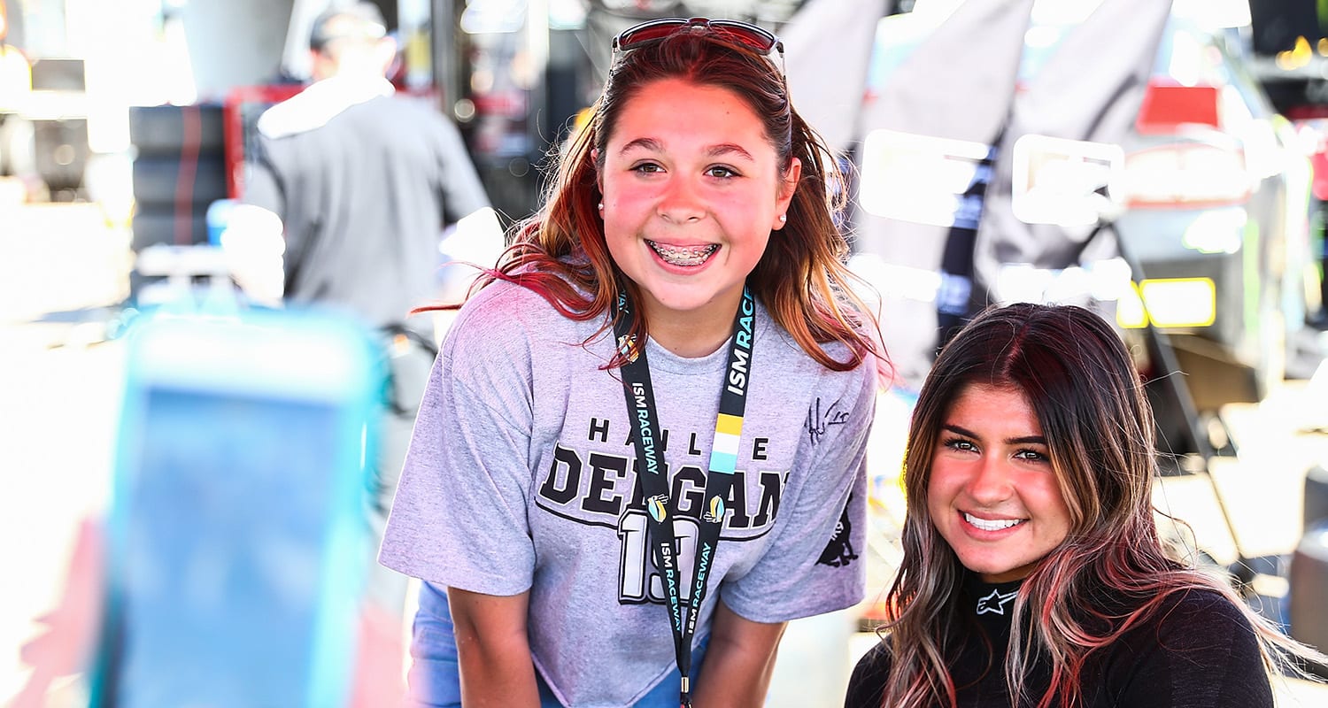 PHOENIX, AZ - MARCH 06: A fan poses for a photo with Hailie Deegan, driver of the #4 Toter Ford, the ARCA Menards General Tire 150 on March 6, 2020 at Phoenix Raceway in Phoenix, Arizona. (Adam Glanzman/ARCA Racing)
