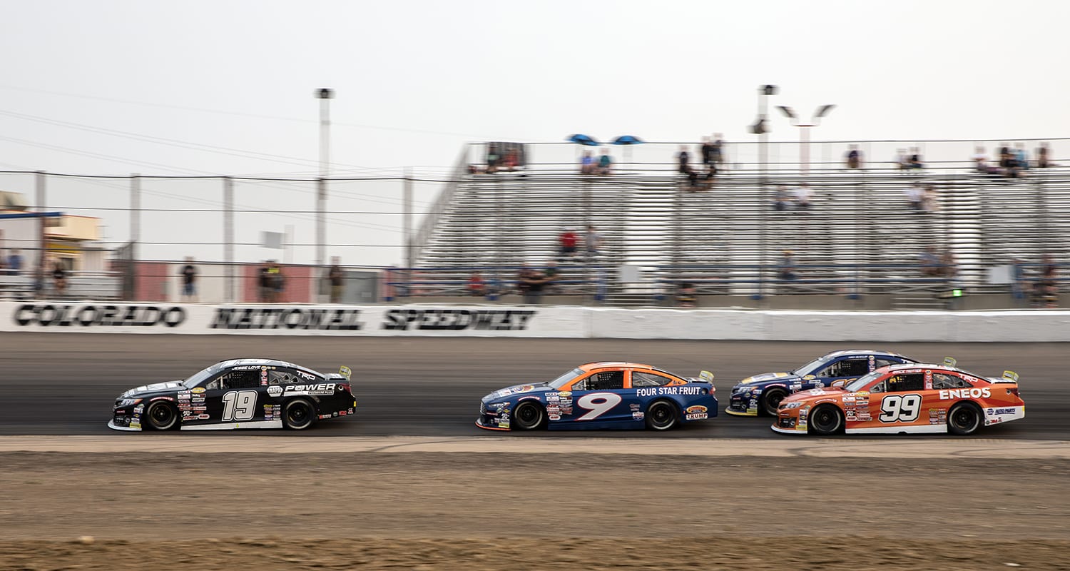 Jesse Love, driver of the #19 NAPA Power Premium Plus Toyota leads Blaine Perkins, driver of the #9 Sunrise Ford/Lucas Oil/Four Star Fruit Ford, Gio Scelzi, driver of the #16 NAPA Auto Parts/Curb Records Toyota and Gracie Trotter, driver of the #99 ENEOS Toyota around turns one and two during the ENEOS 150 Presented by NAPA Auto Parts for the ARCA Menards Series West at Colorado National Speedway in Dacono, Colorado, on Saturday, August 22, 2020. (Chet Strange/ARCA Racing)