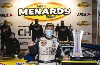 Bret Holmes, driver of the #23 Golden Eagle Syrup Chevrolet celebrates winning the 2020 series championship during the Speediatrics 150 for the ARCA Menards Series at Kansas Speedway on Friday, October 16, 2020. (Barry Cantrell/ARCA Racing)