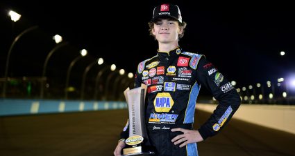 Jesse Love, driver of the No. 19 NAPA Power Premium Plus Toyota, poses for a photo with the ARCA Menards Series West championship trophy at Phoenix Raceway on Nov. 07, 2020 in Avondale, Arizona. (Photo by Jared C. Tilton/Getty Images)