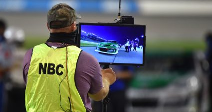 A member of NBC's broadcast team holds a video monitor before the Dawn 150 for the ARCA Menards Series at Kansas Speedway in Kansas City, Kansas, on July 24, 2020. (Ed Zurga/ARCA Racing)