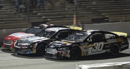 Max Gutierrez, driver of the No. 30 Tough Built Ford, passes Sammy Smith (No. 18) and Taylor Gray (No. 17) in the final stretch to win the Jeep Beach 175 for the ARCA Menards Series East at New Smyrna Speedway in New Smyrna Beach, Florida, on Feb. 8, 2021. (Adam Glanzman/NASCAR)