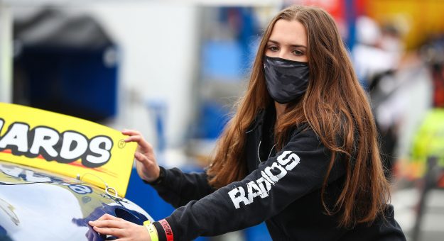 Bridget Burgess, driver of the No. 88 HMH Construction Toyota, pushes her car to the grid before the NAPA 125 for the ARCA Menards Series West at Kern County Raceway Park in Bakersfield, California, on Oct. 25, 2020. (Meg Oliphant/NASCAR)