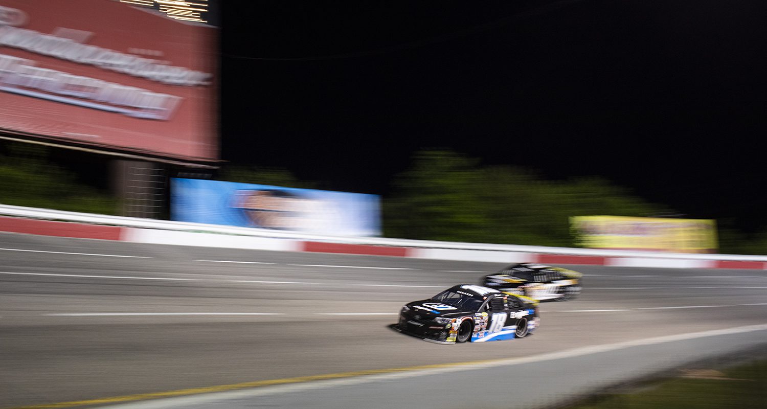Sammy Smith driver of the No. 18 EngineIce Toyota passes the competition to win the Crosley Record Pressing 200 for the ARCA Menards Series East wearing the hat of sponsors at Nashville Fairgrounds Speedway in Nashville, Tennessee, on May 8, 2021. (Silas Walker/ARCA Racing)