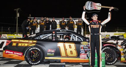 Sammy Smith, driver of the #18 TMC Toyota, holds up the guitar trophy after winning the Music City 200 for the ARCA Menards Series East at Nashville Fairgrounds Speedway in Nashville, Tennessee, on May 7, 2022. (Austin Anthony/ARCA Racing)