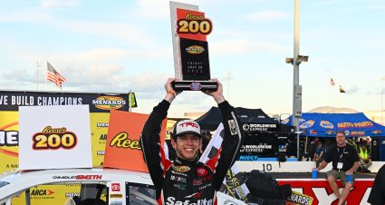 Chandler Smith, driver of the #15 QuickTie/ChargeMe Toyota, raises the trophy after winnging the Reese’s 200 for the ARCA Menards Series at Lucas Oil Indianapolis Raceway Park in Indianapolis, IN on July 29, 2022. (Ben Jackson/ARCA Racing)