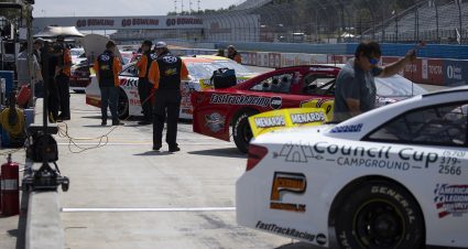 Crews work on their cars in pit lane before the Clean Harbors 100 at The Glen for the ARCA Menards Series at Watkins Glen International in Watkins Glen, New York on August 6, 2021. (Brett Carlsen/ARCA Racing)