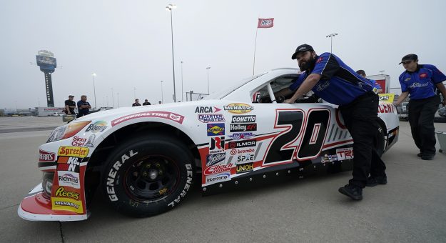 Crew members for Corey Heim, driver of the #20 Crescent Tools Toyota push his car to inspection prior to the Kansas 150 for the ARCA Menards Series at Kansas Speedway in Kansas City, Kansas on September 10, 2022. (Ed Zurga/ARCA Racing)