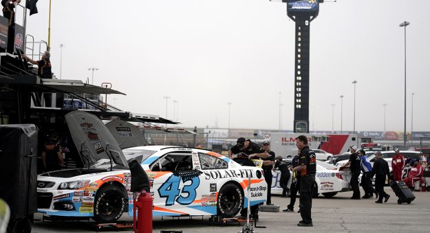 Crew members for Daniel Dye, driver of the #43 Race To Stop Suicide Chevrolet, work on his car prior to practice for the Kansas 150 for the ARCA Menards Series at Kansas Speedway in Kansas City, Kansas on September 10, 2022. (Ed Zurga/ARCA Racing)
