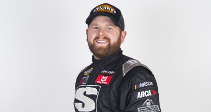 Caleb Costner, driver of the #95 Innovative Tiny Houses, poses for a photo before the Race to Stop Suicide 200 presented by Place of Hope for the ARCA Menards Series East during of the World Series of Asphalt Stock Car Racing event at New Smyrna Speedway in New Smyrna, Florida on February 15, 2022. (Adam Glanzman/NASCAR)