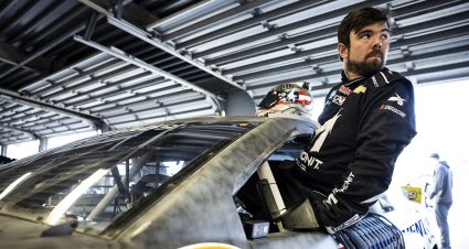 Daytona Beach, FL - January 13: Gus Dean driver of the #25 VMS Toyota looks on in the garage area during ARCA testing at Daytona International Speedway on January 13, 2023 in Daytona Beach, Florida. Photo by James Gilbert/NASCAR.