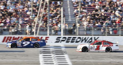 Tanner Reif, driver of the #9 Sunrise Racing Ford, and Jake Finch, driver of the #1 Pheonix Construction Toyota, race during the NAPA Auto Parts 150 presented by West Coast Stock Car Hall of Fame for the ARCA Menards Series West at Irwindale Speedway in Irwindale, California on July 2, 2022. (Michael Owens/ARCA Racing)
