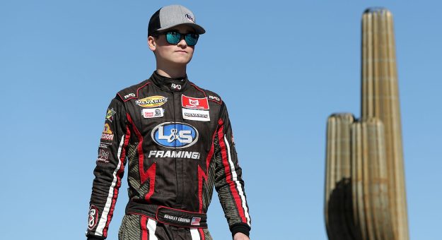 AVONDALE, ARIZONA - NOVEMBER 04: Bradley Erickson, driver of the #84 L&S Framing-Fastland Motorsports Ford, walks onstage during driver intros prior to the ARCA Menards Series West Desert Diamond Casino West Valley 100 at Phoenix Raceway on November 04, 2022 in Avondale, Arizona. (Photo by Meg Oliphant/Getty Images) | Getty Images