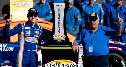 Jake Drew, driver of the #6 Sunrise Racing, Molecule,Group A Ford poses with Bob Bruncati with the 2022 ARCA Menards Series Championship Trophy after the Desert Diamond Casino West Valley 100 for the ARCA Menards Series West at Phoenix Raceway in Avondale, Arizona, on November 4, 2022. (Zac BonDurant/ARCA Racing)