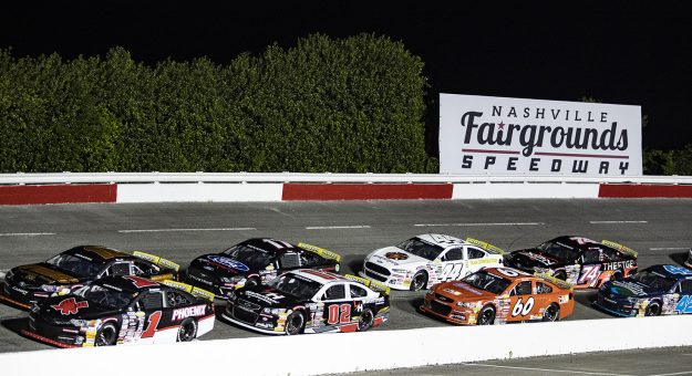 Cars drive behind the pace car at the beginning of the Music City 200 for the ARCA Menards Series East at Nashville Fairgrounds Speedway in Nashville, Tennessee, on May 7, 2022. (Austin Anthony/ARCA Racing)