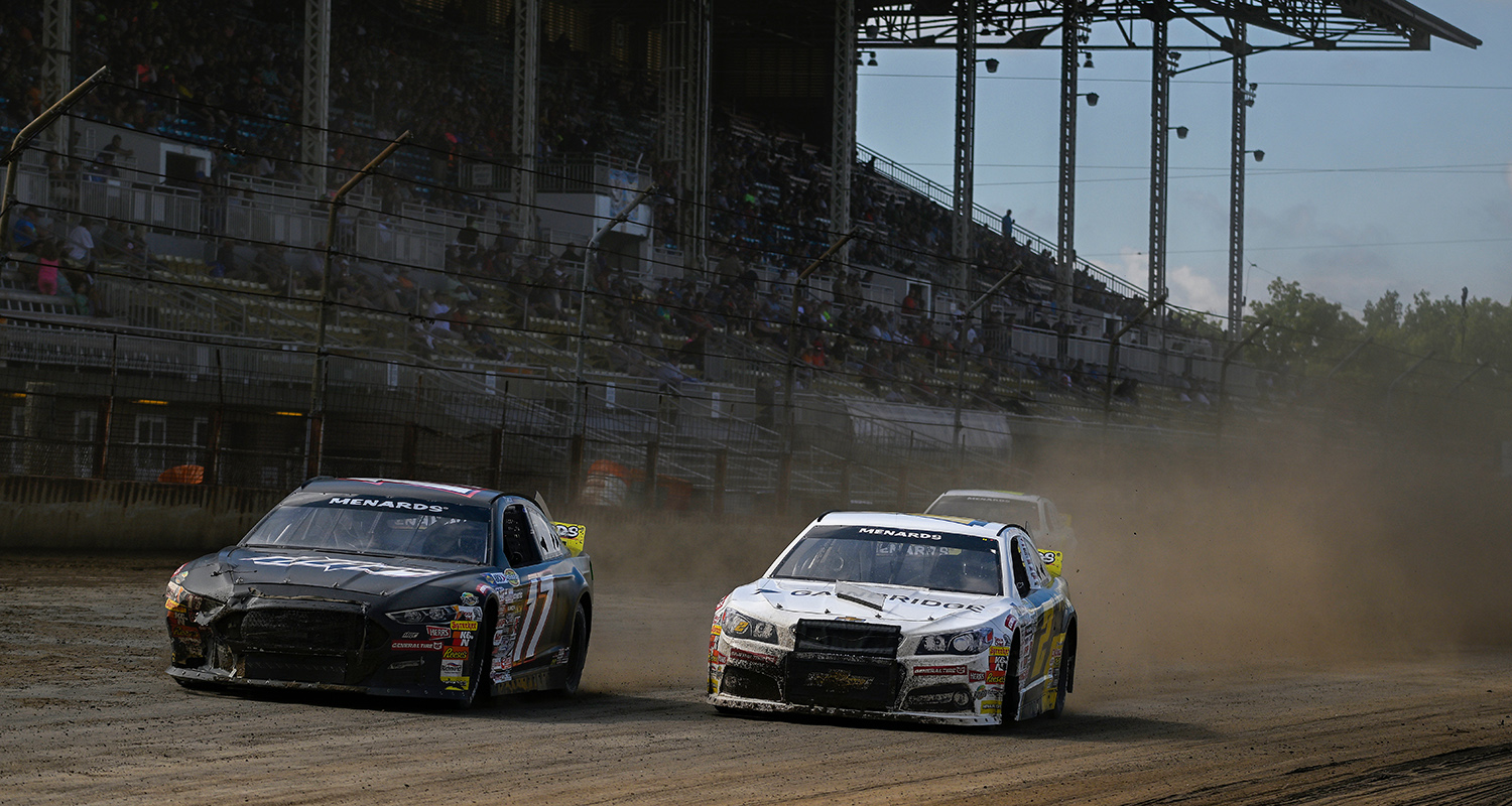 Taylor Gray, driver of the #17 Ford Performance-Mission 22 Ford, and Nick Sanchez, driver of the #2 Gainbridge-Max Siegel Inc Chevrolet, drive during the Atlas 100 for the ARCA Menards Series at the Illinois State Fairgrounds in Springfield, Illinois on August 21, 2022. (Jeff Curry/ARCA Racing)