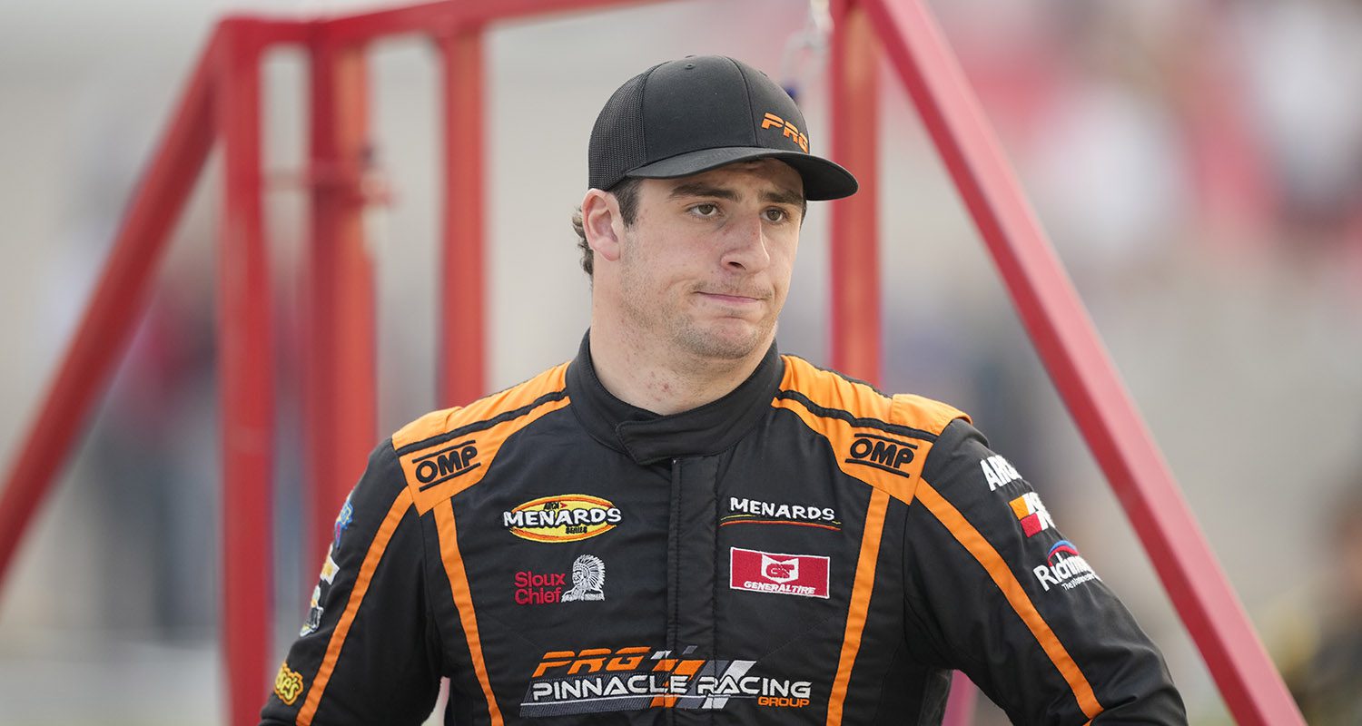 Luke Fenhaus, driver of the #28 Chevrolet Performance Chevrolet heads to his car for the Calypso 150 for the ARCA Menards Series and the ARCA Menards Series East at Iowa Speedway in Newton, Iowa on July 15, 2023. (Matthew Putney/ARCA Racing)