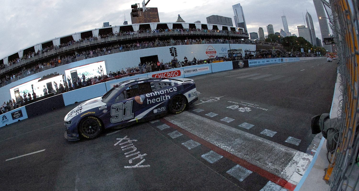 CHICAGO, ILLINOIS - JULY 02: Shane Van Gisbergen, driver of the #91 Enhance Health Chevrolet, crosses the finish line to win the NASCAR Cup Series Grant Park 220 at the Chicago Street Course on July 02, 2023 in Chicago, Illinois. (Photo by Sean Gardner/Getty Images) | Getty Images