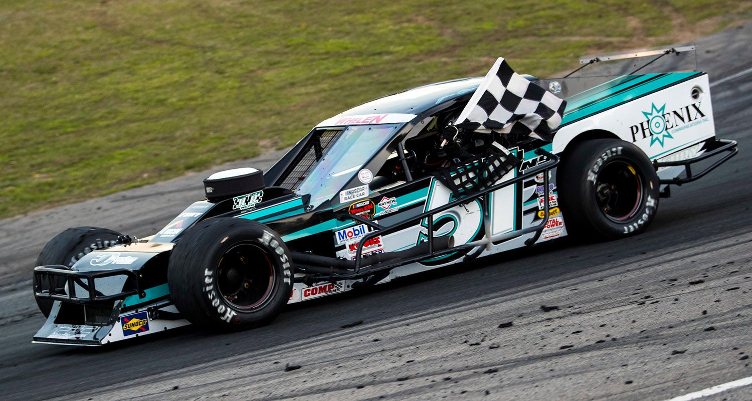 Justin Bonsignore, driver of the #51 Phoenix Communications Inc. Chevrolet, takes victory lap during the Independence Day 200 for the NASCAR Whelen Modified Tour at White Mountain Motorsports Park in North Woodstock, New Hampshire on Saturday, July 4, 2020. (Adam Glanzman/NASCAR)