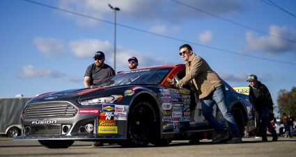 Crew members move the car of Becca Monopoli