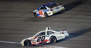 Jake Bollman spins after more contact with Thomas Annunziata at Kansas
